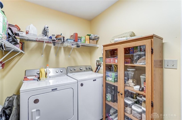 laundry room featuring washing machine and clothes dryer