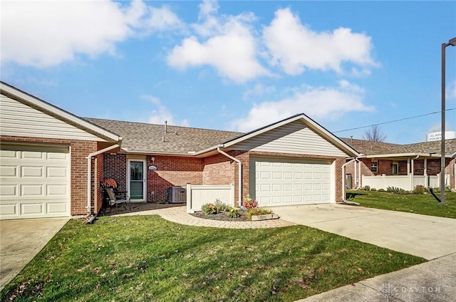 single story home with a garage, a front yard, and cooling unit