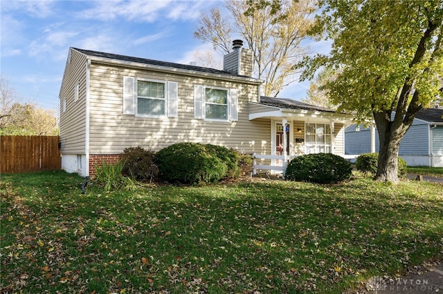 view of front of home with a porch and a front lawn