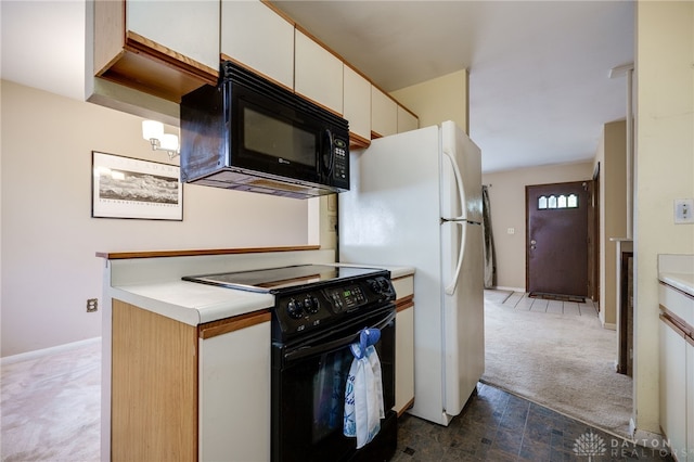 kitchen featuring white cabinetry, carpet, and black appliances