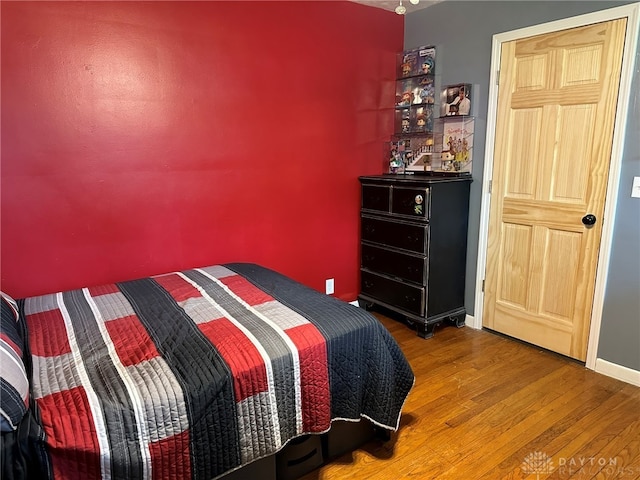 bedroom featuring wood-type flooring