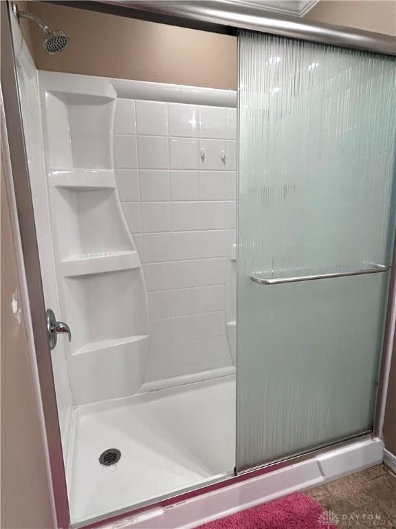 bathroom featuring an enclosed shower