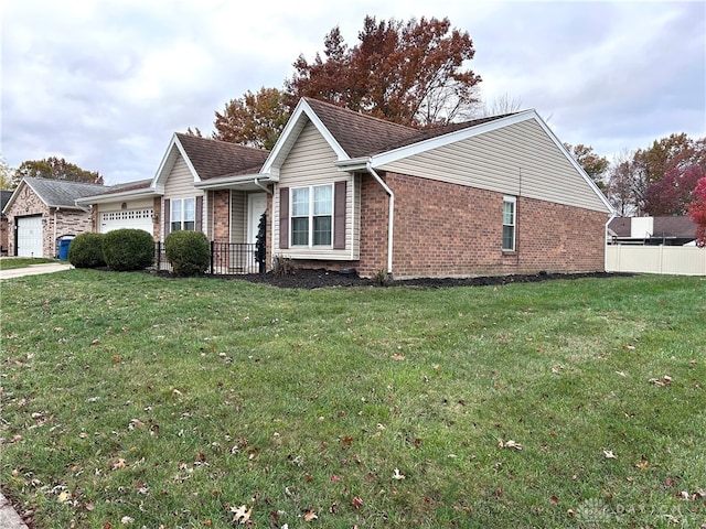 view of home's exterior with a garage and a yard