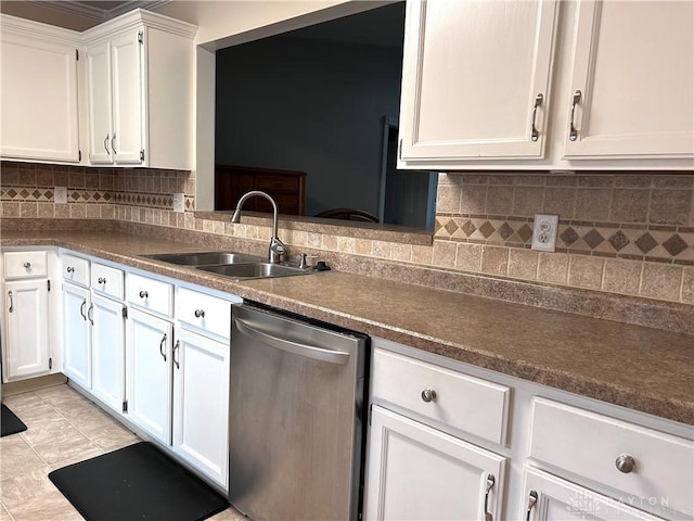 kitchen with dishwasher, decorative backsplash, white cabinetry, and sink