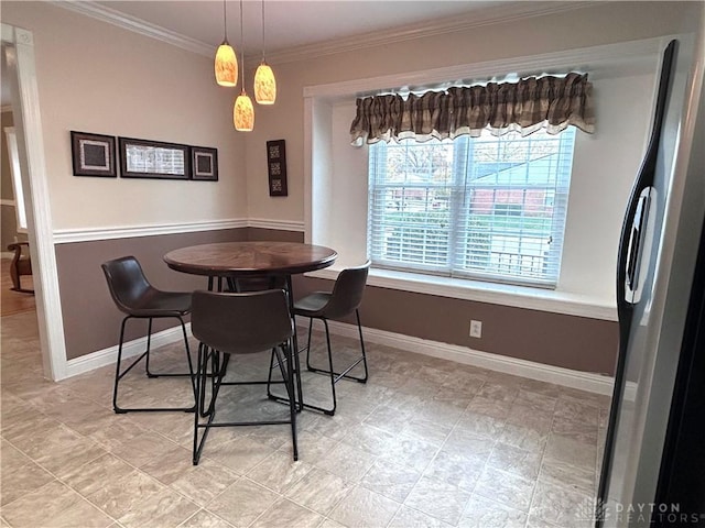 dining room featuring ornamental molding