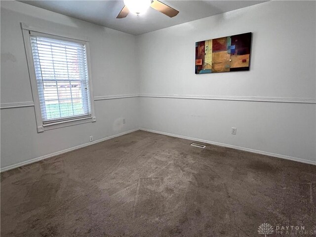 unfurnished room with carpet and ceiling fan