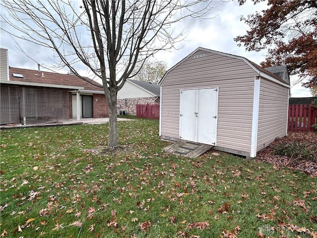 view of outdoor structure featuring a lawn