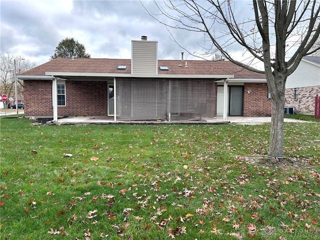 back of house with a yard, a patio, and central AC unit