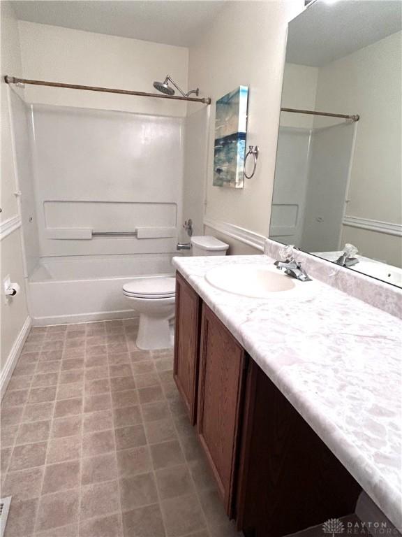 full bathroom featuring vanity, toilet, and tub / shower combination