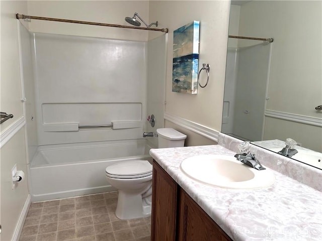 full bathroom with vanity, bathtub / shower combination, and toilet