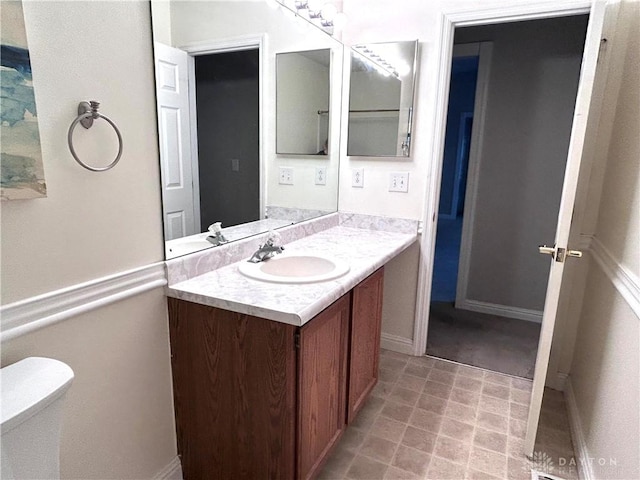 bathroom with vanity and toilet