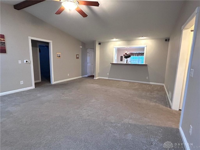 unfurnished living room with carpet flooring, vaulted ceiling with beams, and ceiling fan with notable chandelier