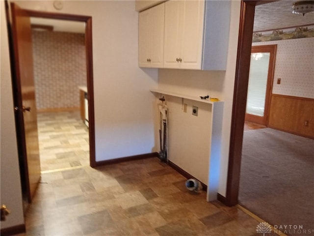 clothes washing area featuring cabinets and hookup for an electric dryer