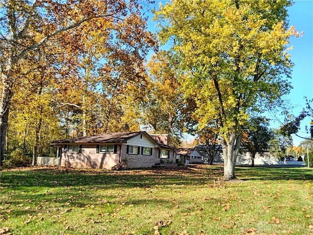 view of property exterior featuring a yard