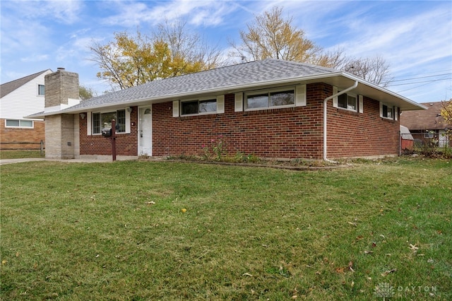 single story home with a front lawn