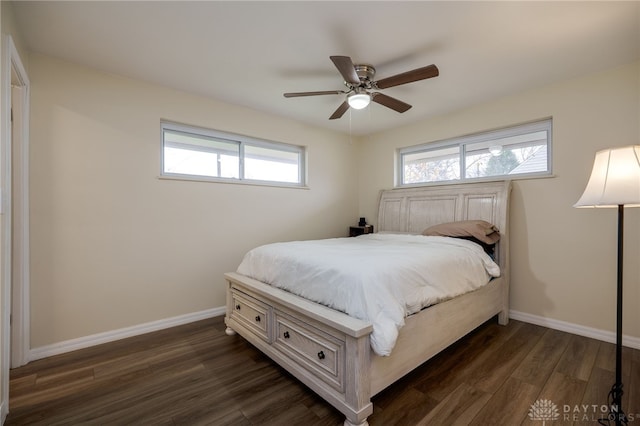 bedroom with ceiling fan and dark wood-type flooring