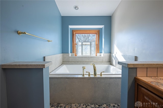 bathroom with tiled bath