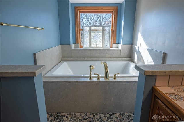 bathroom with tiled bath