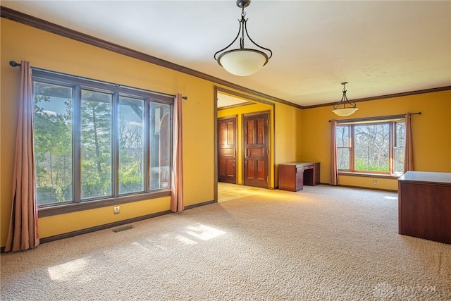 interior space with ornamental molding and light colored carpet