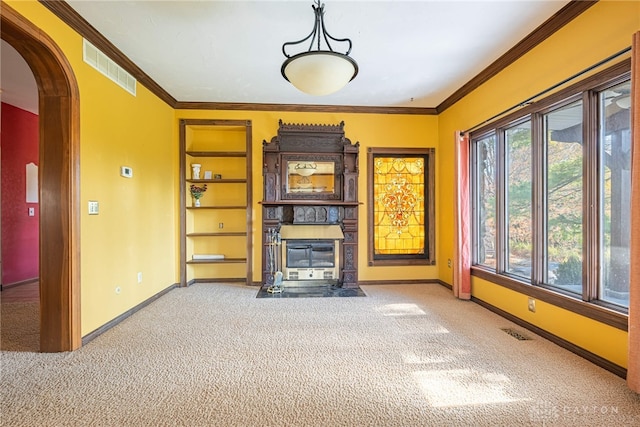 unfurnished living room featuring carpet floors and ornamental molding