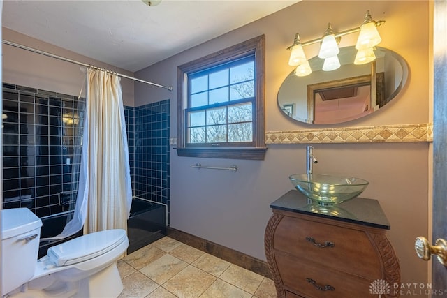 full bathroom featuring toilet, vanity, shower / bath combination with curtain, and tile patterned floors