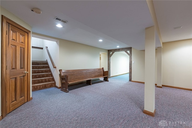 basement featuring carpet flooring