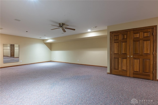 unfurnished room with carpet flooring and ceiling fan