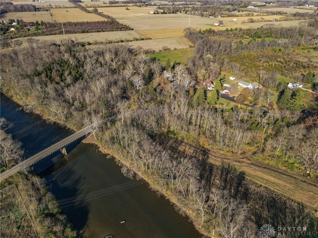 drone / aerial view with a water view and a rural view