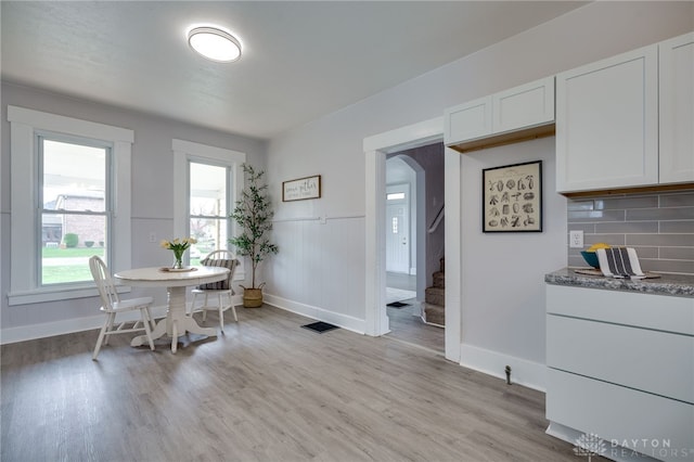 dining area featuring light wood-type flooring