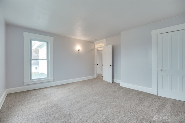 unfurnished room with carpet