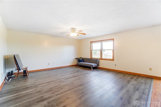 unfurnished room featuring hardwood / wood-style floors and ceiling fan