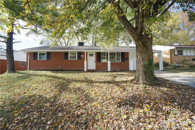 ranch-style home featuring a front yard