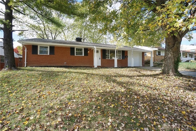 ranch-style home with a front lawn and a garage