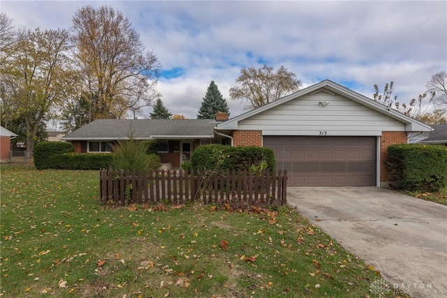 ranch-style home featuring a garage and a front yard