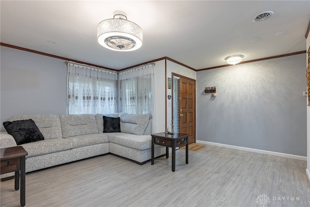 living room featuring light wood-type flooring and crown molding