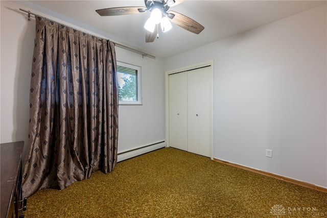 unfurnished bedroom with ceiling fan, a baseboard radiator, a closet, and carpet flooring