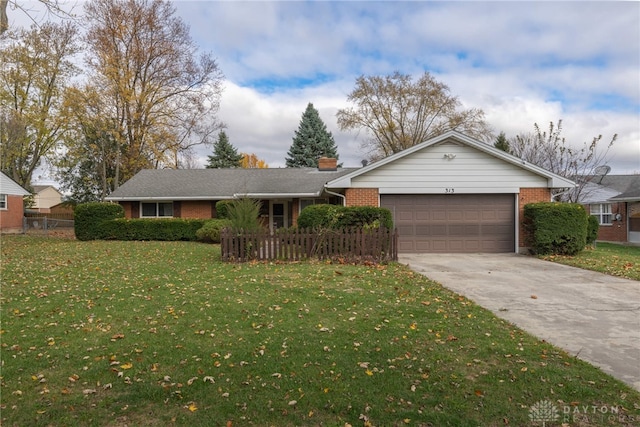 single story home featuring a garage and a front lawn