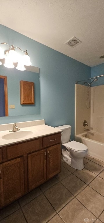 bathroom with tile patterned floors, toilet, vanity, visible vents, and tub / shower combination