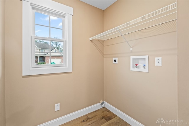 washroom featuring hardwood / wood-style flooring, hookup for an electric dryer, and washer hookup