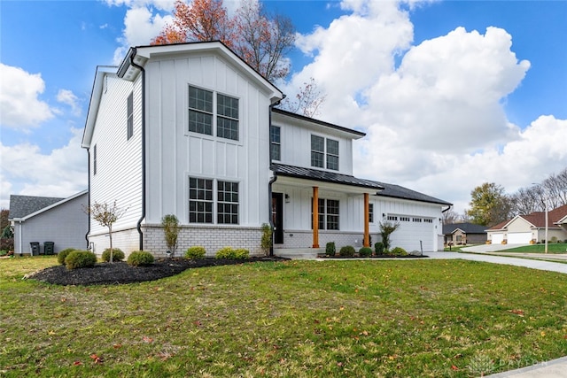 modern farmhouse style home with a porch, a garage, and a front yard