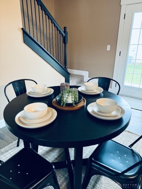 dining space featuring hardwood / wood-style floors