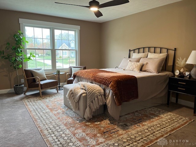 bedroom featuring ceiling fan and carpet floors