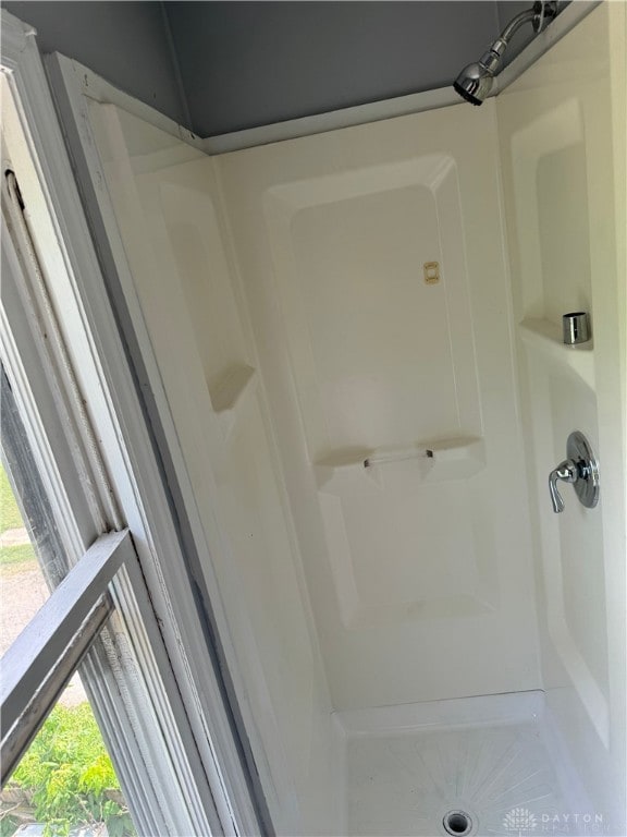 bathroom featuring walk in shower