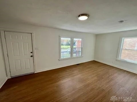 empty room featuring dark hardwood / wood-style floors