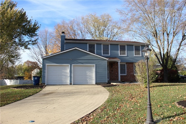 view of property with a front yard and a garage