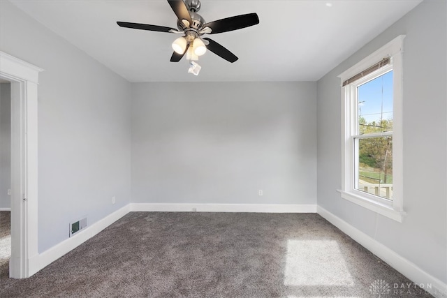 unfurnished room with ceiling fan and carpet flooring