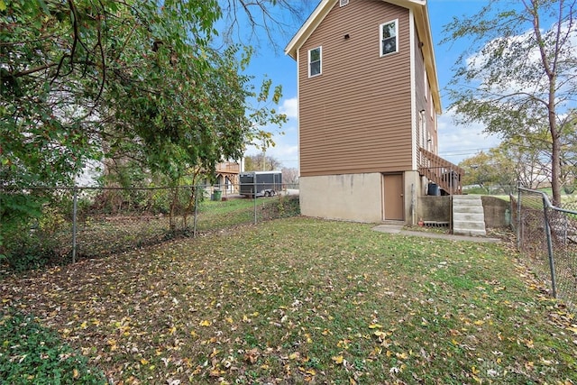 view of property exterior featuring a lawn