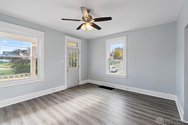 spare room with wood-type flooring and ceiling fan