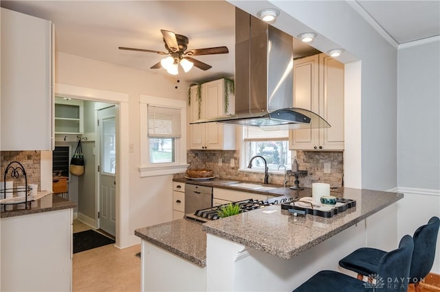 kitchen with dark stone countertops, backsplash, and exhaust hood