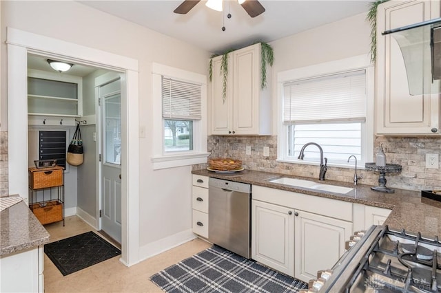 kitchen with white cabinets, dishwasher, sink, and tasteful backsplash